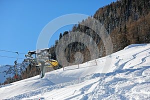 Chair lift. Ski lift chair engine by misty snowy day in mountains area. Alpe Liusia, Trentino Alto Adige, Moena, Val di Fassa, Dol