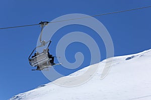 Chair lift at ski resort. Winter vacations