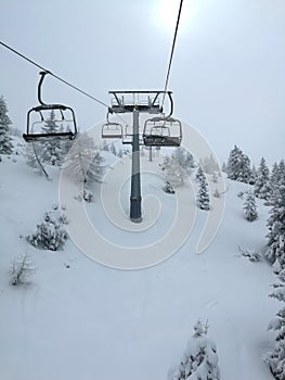 Chair lift snow mountain gloomy day