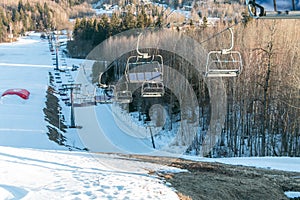 Chair lift to lift snowboarders and skiers uphill. Winter sports concept. Winter extreme sport.