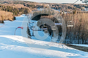 Chair lift to lift snowboarders and skiers uphill. Winter sports concept. Winter extreme sport. Ski resort