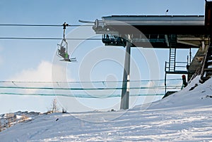 Chair lift to the slope in the alps view from bottom