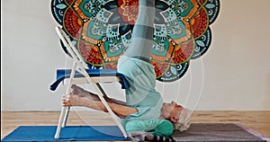 Chair, old woman and yoga with fitness, home and retirement with hobby and activity. Pensioner, senior person and mature