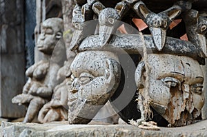 Chair and other African wood carvings at traditional Fon`s palace in Bafut, Cameroon, Africa