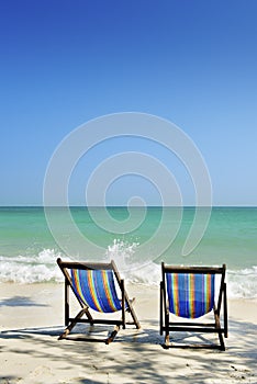 Chair in sea sand sun