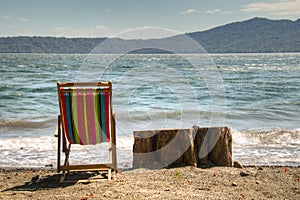 Chair at the shore of lake Apoyo near Granada, Nicaragua