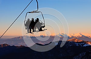 Chair ski lift with skiers