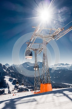 Chair or ski lift in snowy high mountains