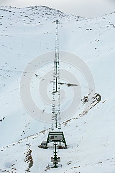 Chair ski lift in South island, New zealand with snow covered the mountains