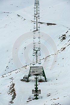 Chair ski lift in South island, New zealand with snow covered the mountains