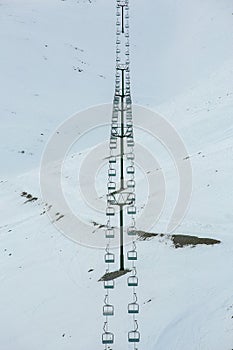 Chair ski lift in South island, New zealand with snow covered the mountains