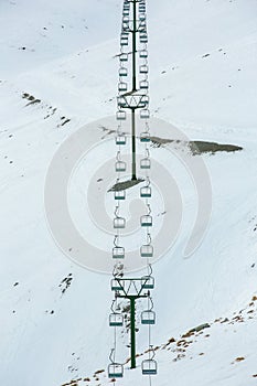 Chair ski lift in South island, New zealand with snow covered the mountains