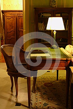 Chair and the table with a lamp