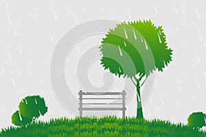 Chair and tree a the rain on green background