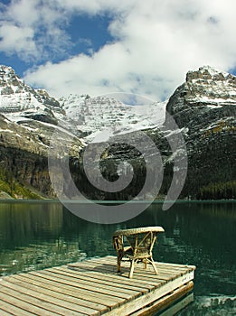 Chair on a wooden pier, Lake O'Hara, Yoho National Park, Canada