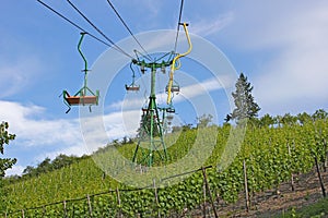 Chairlift above vineyard photo