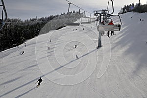 Chairlift and skiers