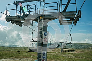 Chairlift towers and cables over hilly landscape