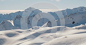 Chairlift view of mountain ridges and Alps peaks in Samnaun - Ischgl - Paznaun ski resort, located in Austria and Switzerland