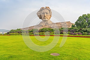 Chairman Mao statue and park lawn in Changsha, Hunan Province, China