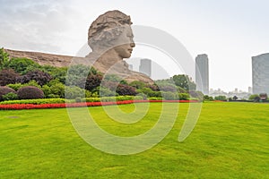 Chairman Mao statue and park lawn in Changsha, Hunan Province, China