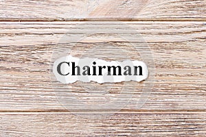 CHAIRMAN of the word on paper. concept. Words of CHAIRMAN on a wooden background