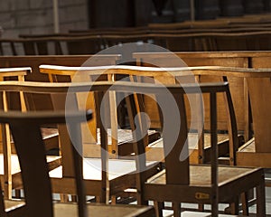 Chairs or benches in the church expresses loneliness and anticipation.