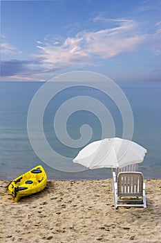 Chairs and canoe on the beach. Dream beach vacation