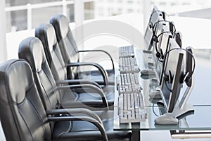 Chairs computers and headset in a modern office