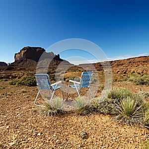 Chairs in desert.
