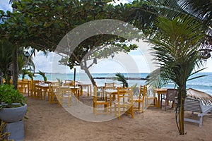 Chairs on a deserted beach. Holiday and vacation concept. photo