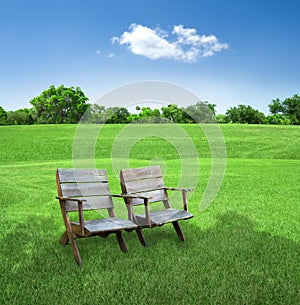 Chairs in field