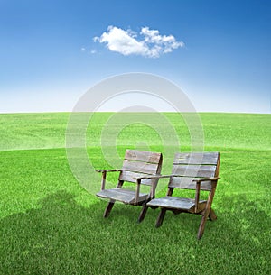 Chairs in field