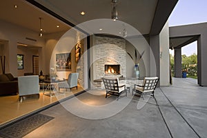 Chairs By Fireplace In Patio