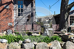 Chairs at the front door with small garden