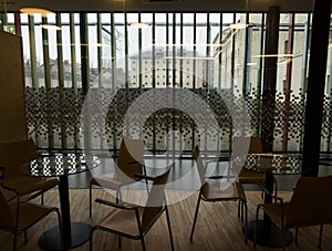 chairs and glass tables in a prison