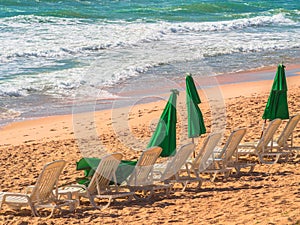 Chairs and green umbrella