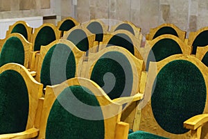 Chairs with green upholstery, rows