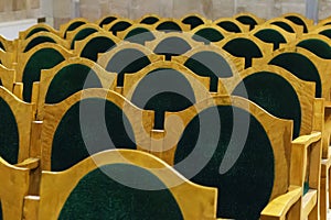 Chairs with green upholstery, rows