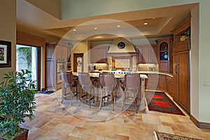 Chairs near contemporary kitchen counter in luxury manor house