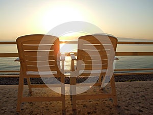 Chairs overlooking ocean photo