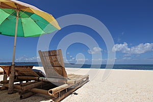 Chairs with parasol on beach