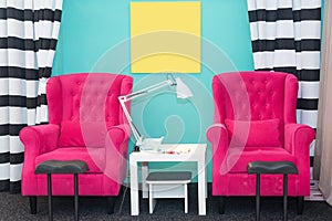 Chairs in a pedicure beauty salon. Interior of empty modern nail salon. Work places for masters of manicure. Pedicure cabinet.