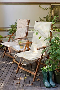 Chairs with pillows outdoors in garden