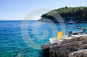 Chairs on a rocky beach in Croatia