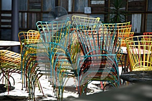 Chairs stacked at outdoor restaurant