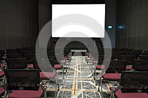 Chairs on stage of grand conference hall with white projector screen