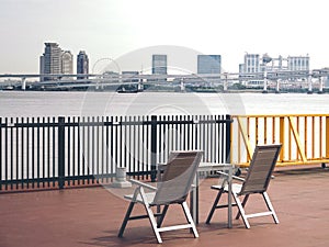 Chairs and Sumida River and Odaiba view