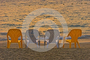 Chairs in sunset in the beautiful Mediterranean beach of Kibbutz Nahsholim in north Israel