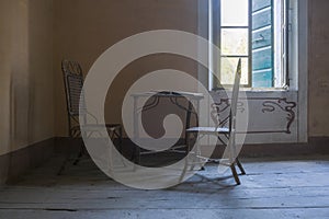 chairs and table in abandoned house in the abandoned house
